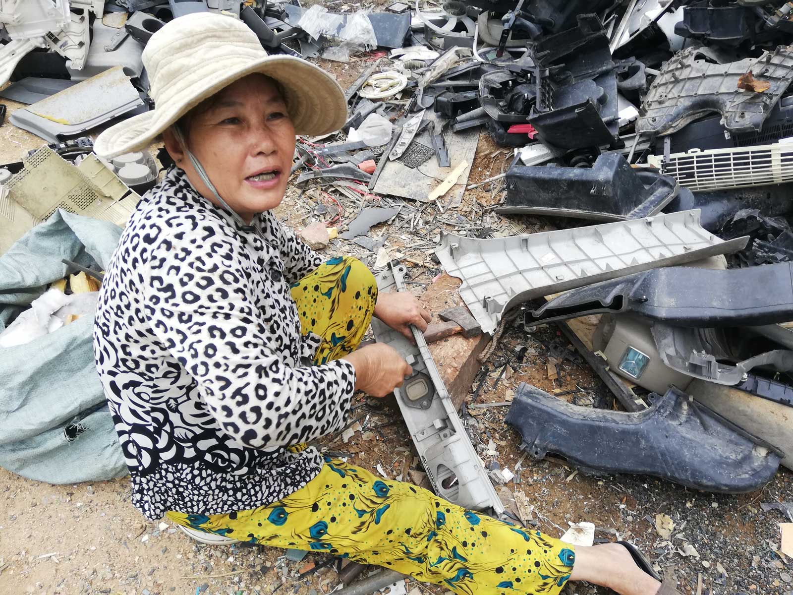 Phnom Penh recycler Mae Kamouy preparing plastic for reuse. Photo: Evie Breese