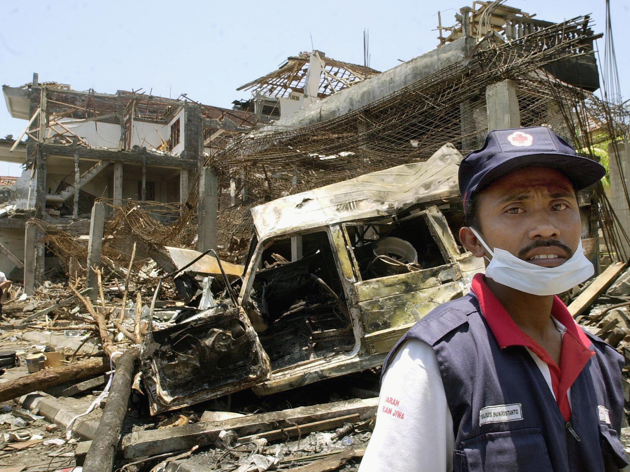 An Indonesian Red Cross volunteer in the tourist area in Kuta, near Denpasar, two days after the car bombing. Photo: Oka Budhi/AFP 