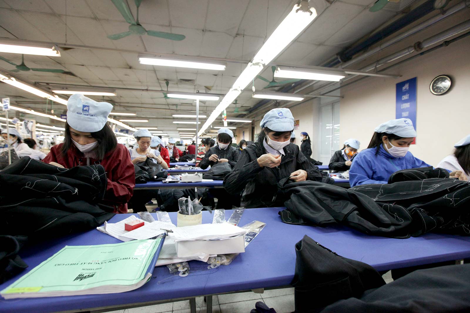 Workers operate at a factory of Vietnam's Garment 10 Corporation (Garco 10) in Hanoi, Vietnam. Vietnam's garment and textile export is expected to reach around 24.5 billion US dollar in 2014, which is 19 percent higher compared with last year, according to Vietnam National Textile and Garment Group.  Photo: Duc Thanh/EPA