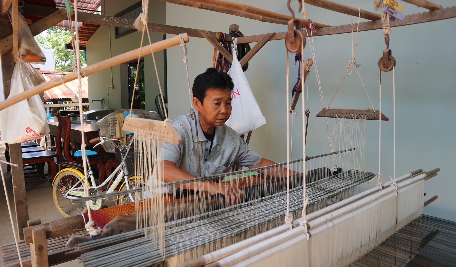 Si Mun now works as a self-taught silkweaver in Kandal Province. Photo: Tabitha Payne