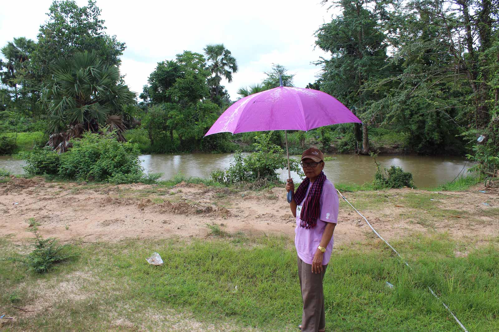 Sitha stands before the part of the canal where he met his wife. Photo: Tabitha Payne