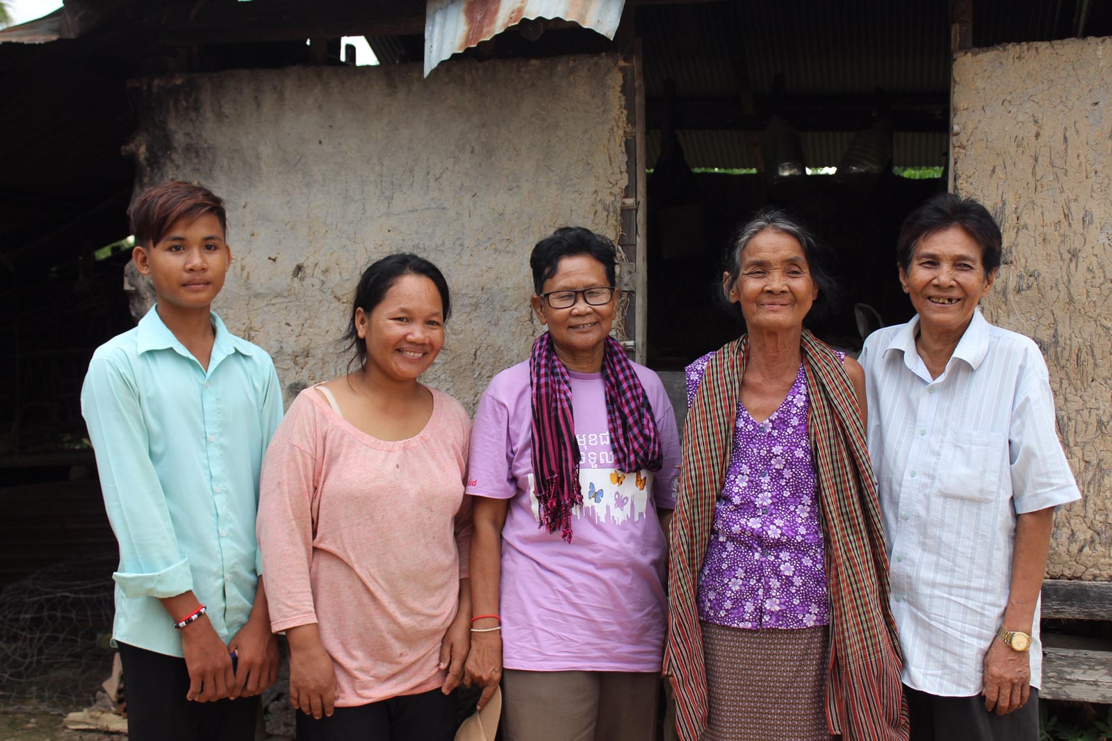 Sitha and Man with the Khmer Rouge leader and her family at her house. Photo: Tabitha Payne