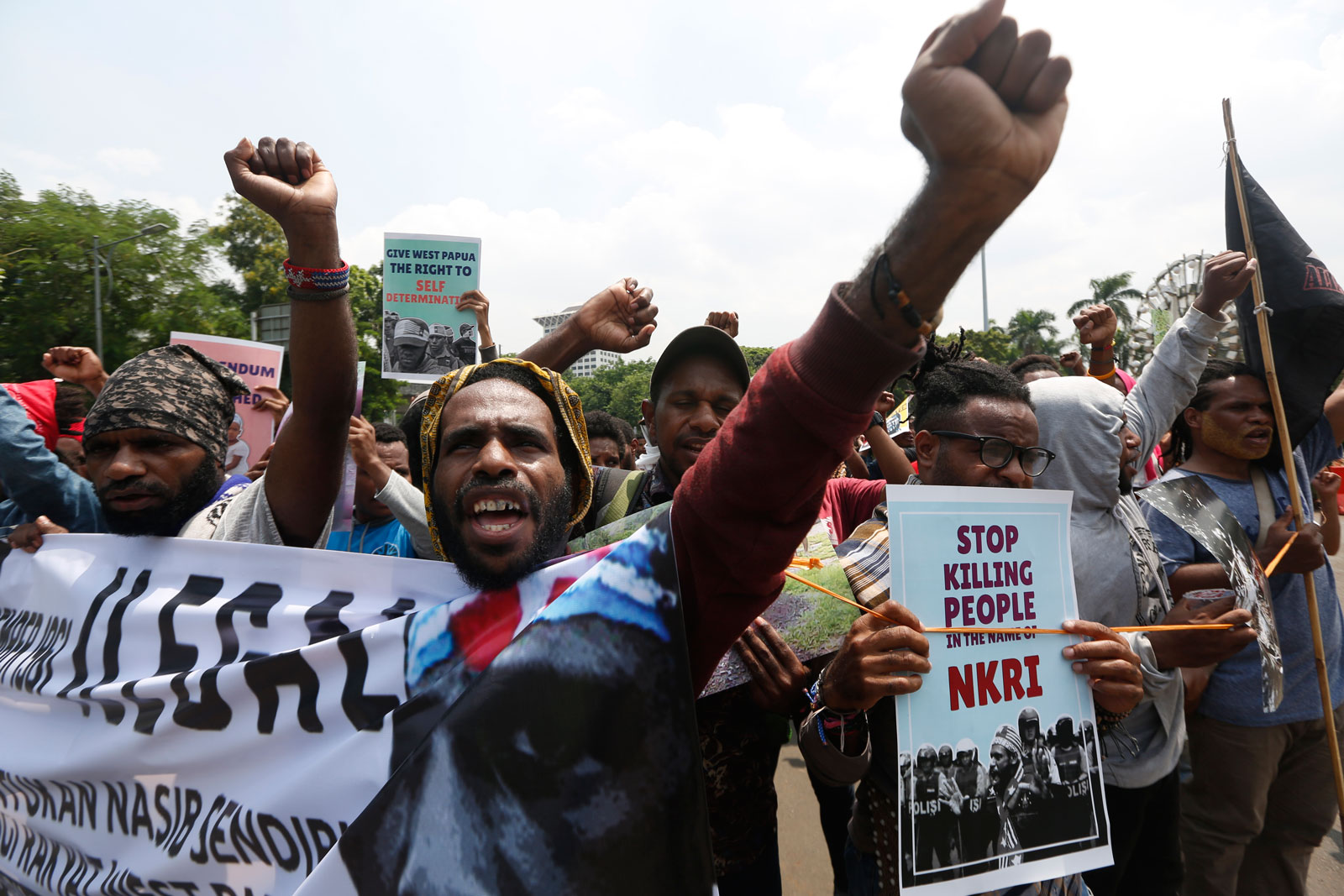 West Papuan activists shout anti-Indonesia slogans during a rally at a main street in Jakarta, Indonesia, 19 December 2018. Dozens of West Papuan activists staged a rally demanding the right to self-determination for West Papua. EPA-EFE/ADI WEDA