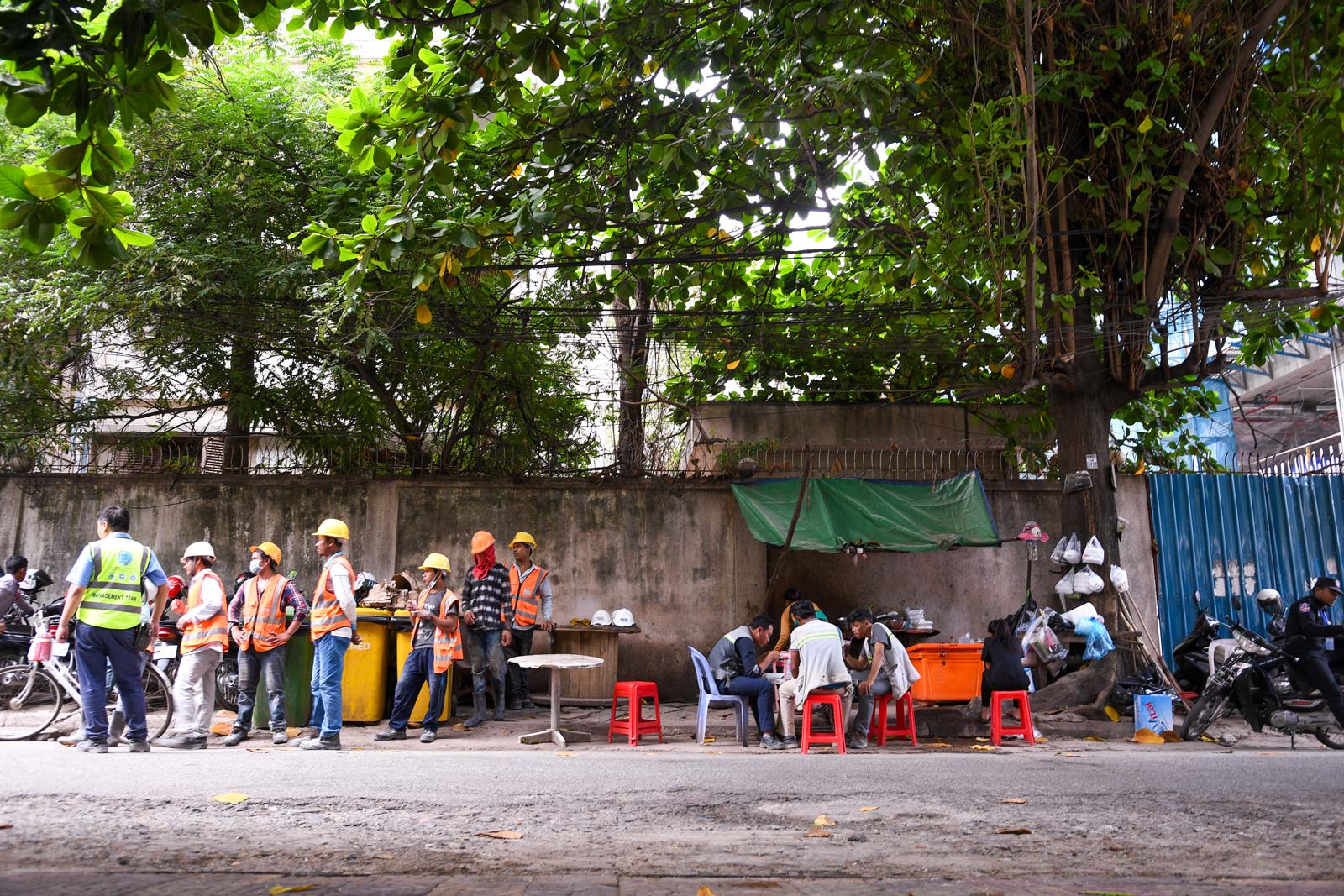 Down the street from a central Phnom Penh building site, workers take a quick break. Photo: Simon Roughneen