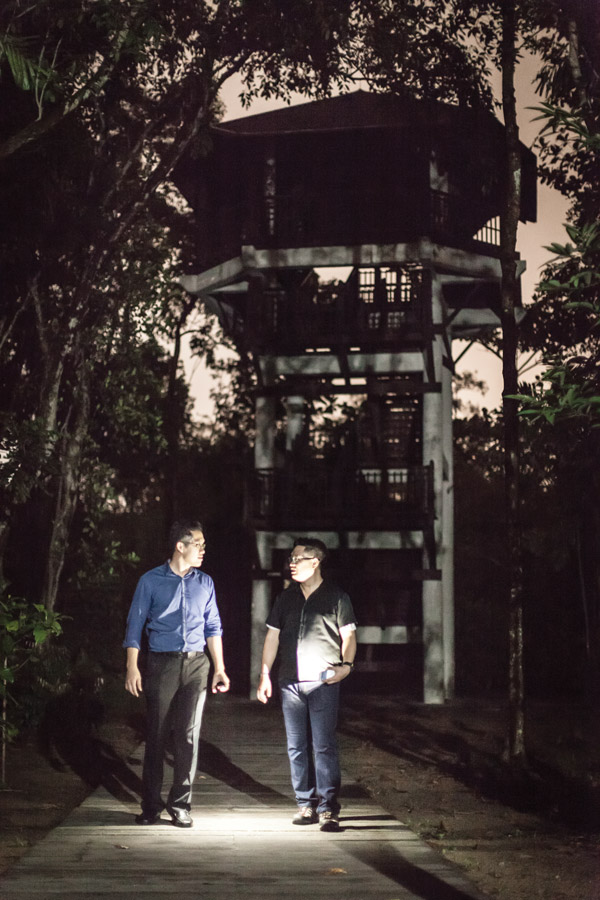 The believers: Jeremy Shiu (left) and Jansen Juan at the observation tower in Pasir Ris park where a woman is said to have committed suicide. Photo: Sam Jam