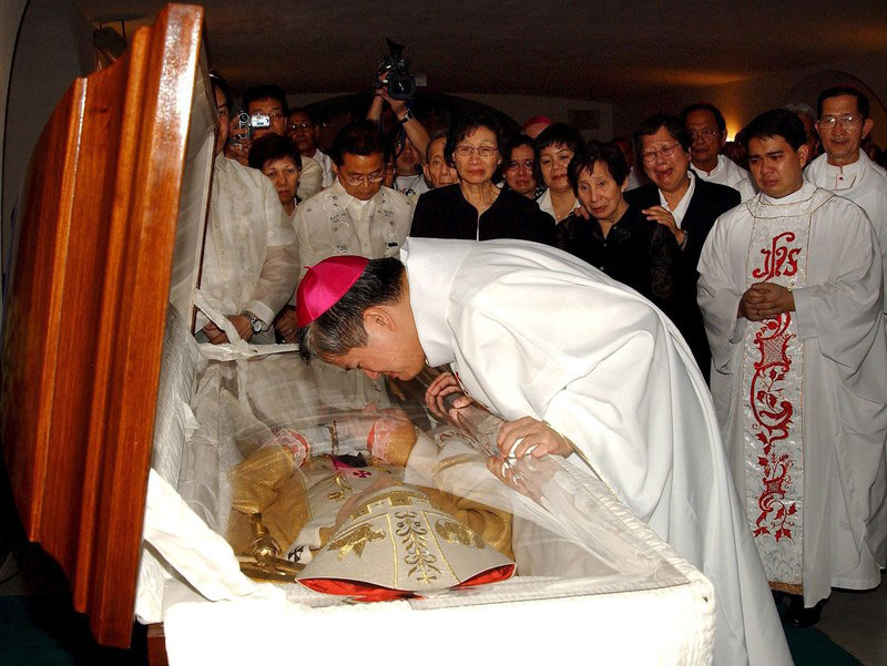 Socrates Villegas kissing the coffin of Cardinal Jaime Sin, one of the leading voices against the Marcos dictatorship, during Sin's funeral at Manila Cathedral in June 2005. Photo: EPA/Noli Yamsuan