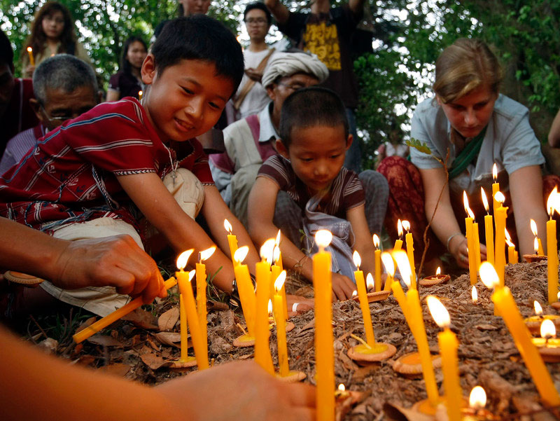 A 2014 candlelit vigil for missing ethnic Karen environmental activist Por Cha Lee Rakcharoen. The remains of "Billy," as he was better-known, were discovered in a reservoir in Thailand in September 2019. Photo: EPA/Pongmanat Tasiri