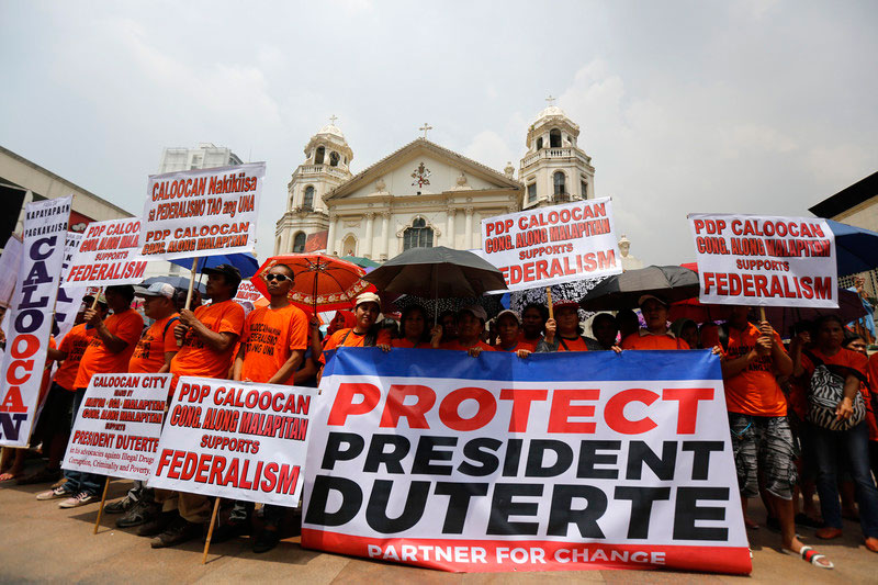 Supporters of President Rodrigo Duterte demonstrate in front of a church in Manila in September 2017 on the 45th anniversary of President Ferdinand Marcos' declaration of martial law. Photo: EPA-EFE/Eugenio Loreto