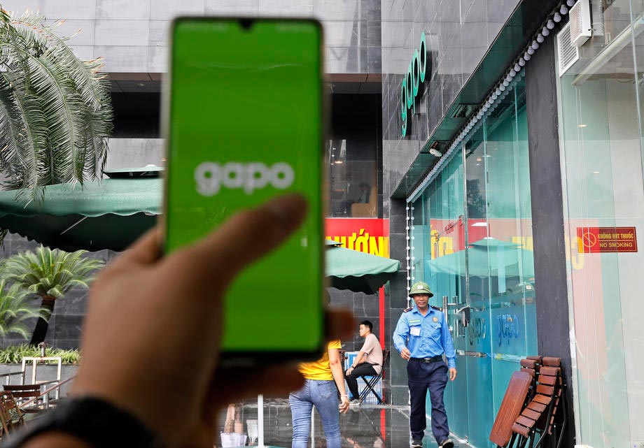 Person shows the opening screenshot of new social networking site Gapo, in a café in Hanoi on 1 August 2019. Gapo aims to have three million users by the end of 2019 and 50 million by 2021. Photo: EPA-EFE/Ming Hoang