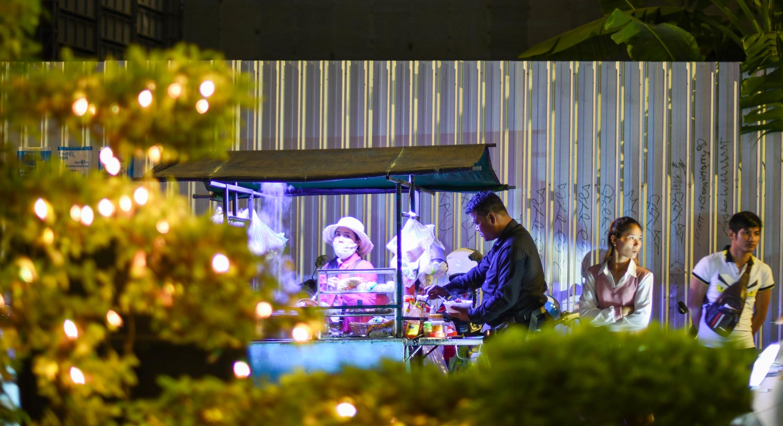 Nighttime is the right time. To eat. Street vendor doing a steady trade near Wat Langka, a famous old temple in Phnom Penh. Photo: Simon Roughneen