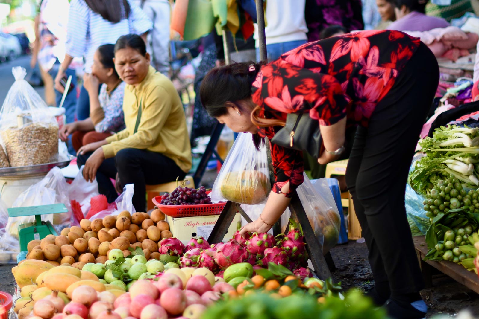 Browsing the fruit and vegetables on offer at a central Phnom Penh market. Photo: Simon Roughneen