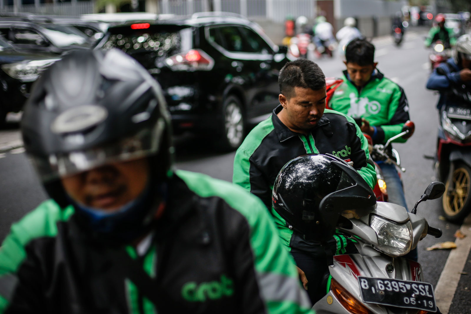 Gojek drivers seen in Jakarta in December 2017. Photo: EPA/Mast Irham