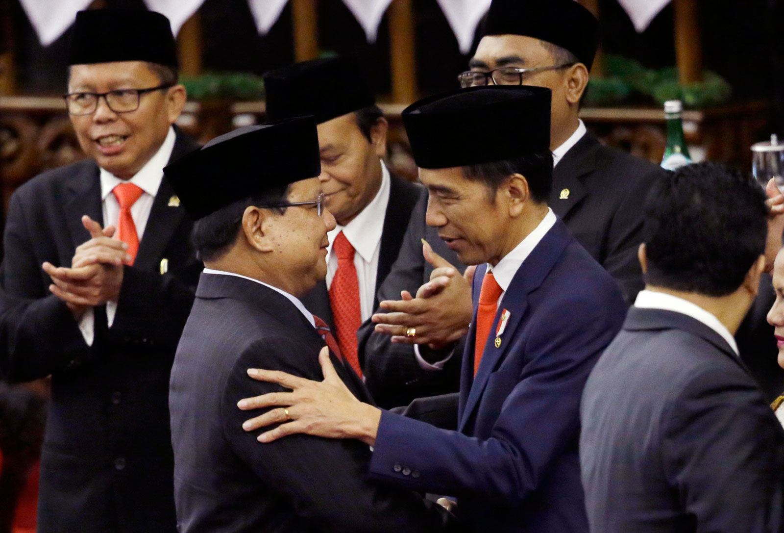 Indonesian President Joko Widodo (R) congratulated by his new defence min. Prabowo Subianto during the presidential swearing-in ceremony in Jakarta on 20 October 2019. Photo: EPA-EFE/Achmad Ibrahim