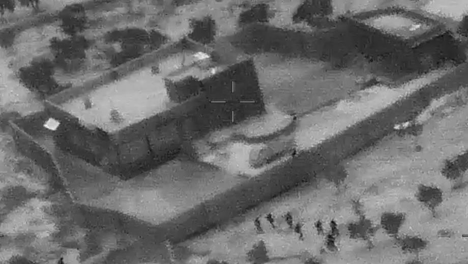 A screengrab from a military drone video made available by the US Defense Video and Imagery Distribution System (DVIDS) shows the compound of ISIS leader Abu Bakr al-Baghdadi during the US forces (bottom) raid in northwestern Syria on 26 October 2019 (Issued 30 October 2019) in which US Forces killed Abu Bakr al-Baghdadi, the founder and leader of ISIS. Photo: EPA-EFE/DVIDS handout