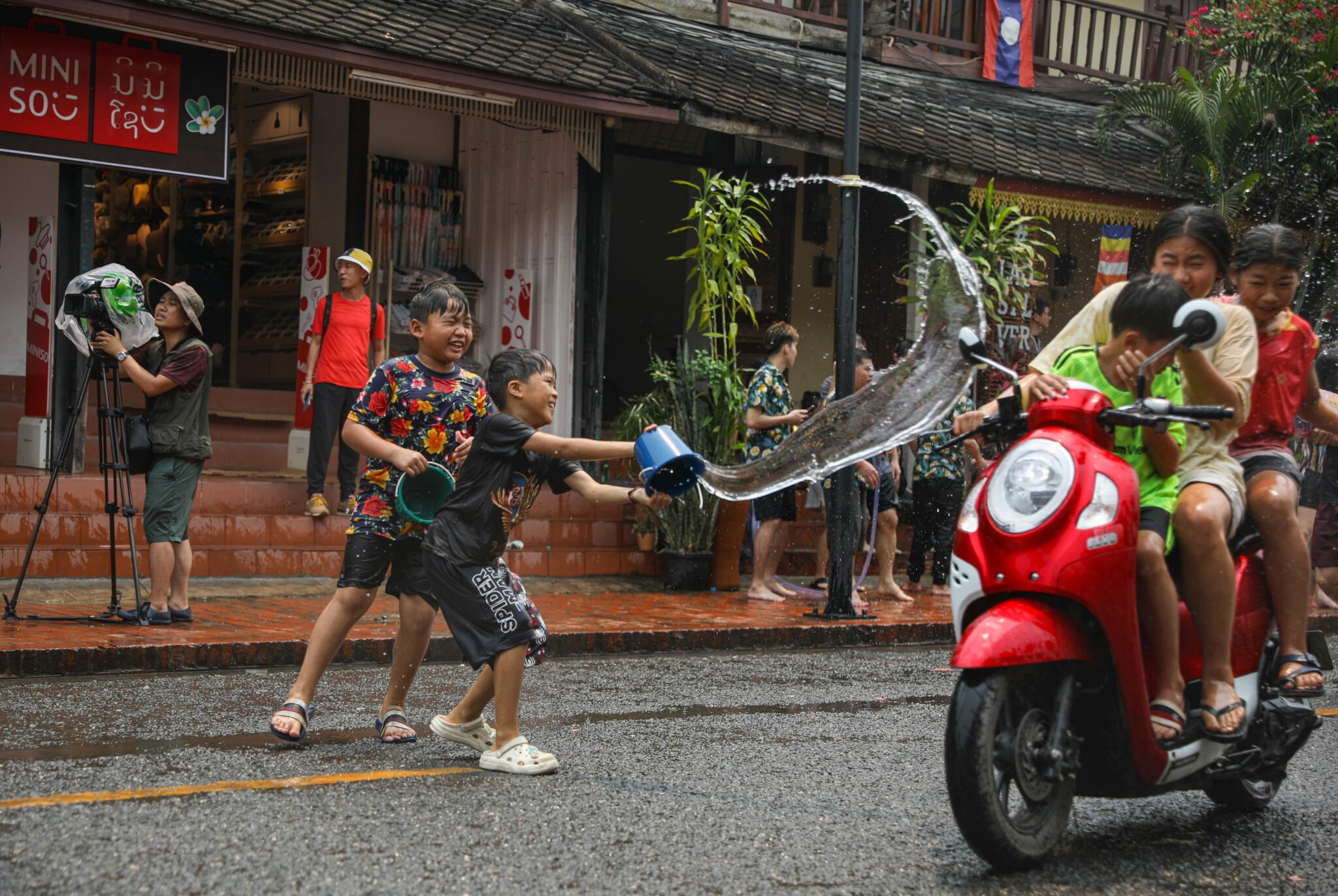Laos celebrates new year in full tilt with pandemic precautions aside